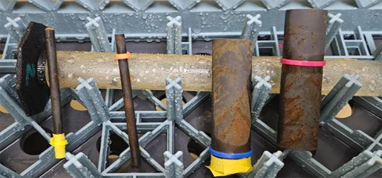 Both parts after 48 hours of continuous B117 salt spray testing
