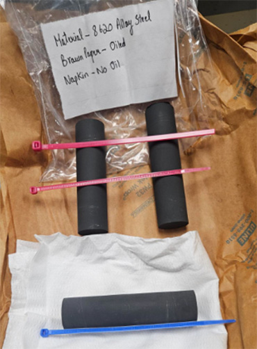 Two pieces oiled (pink marker) and one piece not oiled (blue marker)